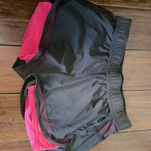 Black and pink sports shorts. Gym shorts. Workout.